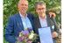 Eine Ehrenurkunde zum 25-jährigen Bestehen vom IHK-Potsdam: Es freuen sich Frank Grädler (l.) und Detlef Malz.