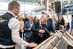 Bundeskanzler Olaf Scholz bei seinem Messerundgang auf der Zukunft Handwerk am Stand der Firma SolteQ, die Photovoltaik-Dachpfannen anbietet.